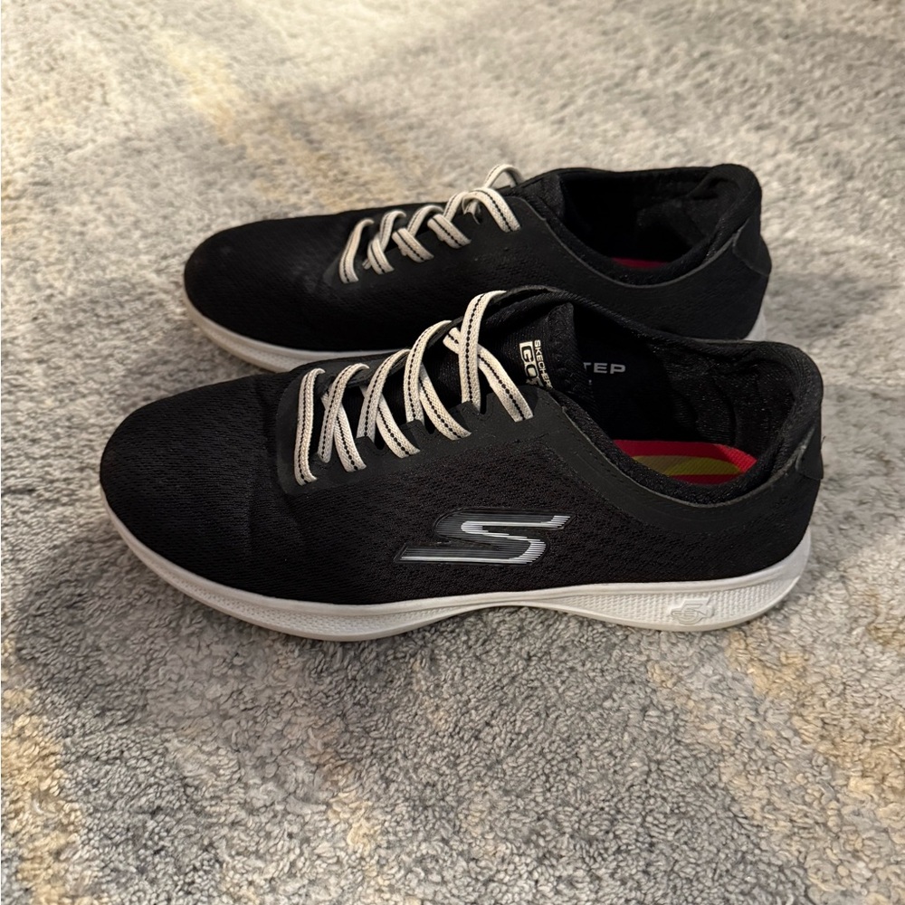 Skechers women’s  Black and White Sneakers